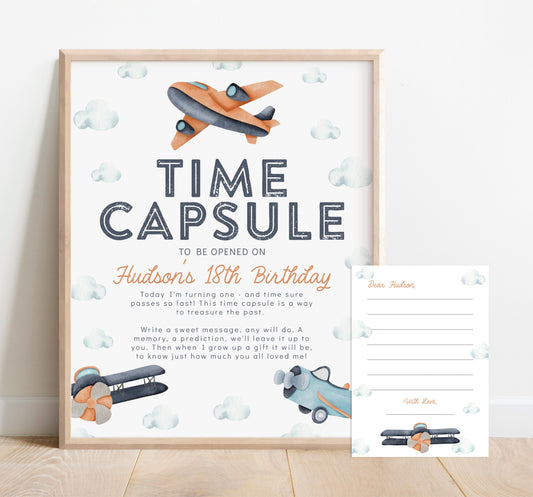 airplane time capsule for 1st birthday party.  navy blue, turquoise and orange watercolor airplane graphics and clouds adorn this modern retro design.