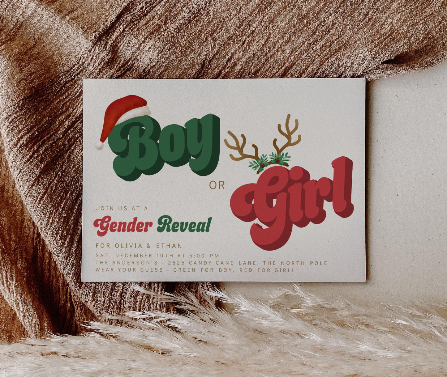 Christmas gender reveal invitation with retro red and green “Boy or Girl” text featuring Santa hat, reindeer antlers, and festive holiday accents on a neutral background.