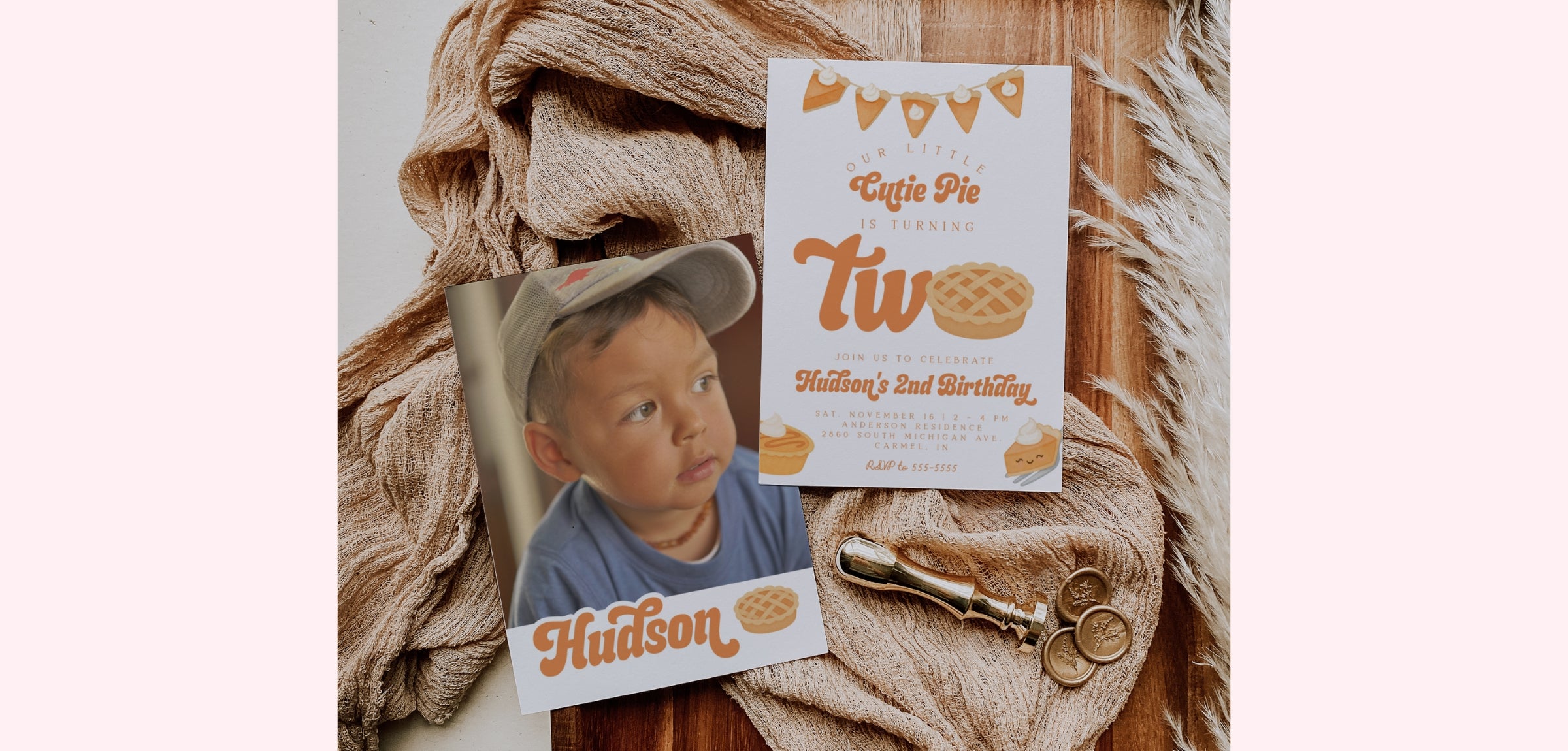 A styled flat-lay of a custom birthday invitation card and a matching photo print featuring a child, arranged on a rustic wood surface with a beige knit blanket and gold-toned scissors.