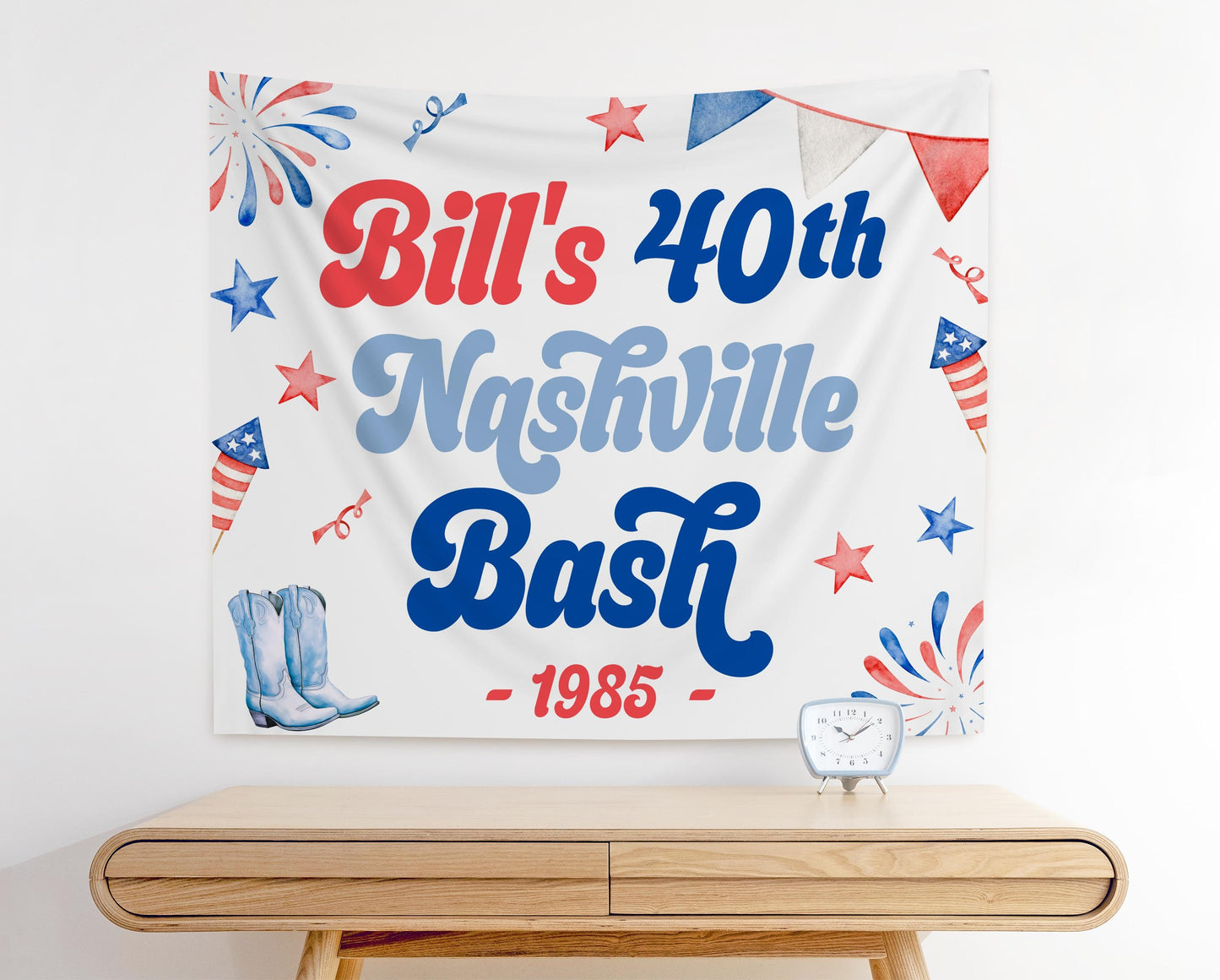 Bill’s 40th Nashville Bash backdrop with red, white, and blue fireworks, cowboy boots, patriotic stars, and bold lettering for country western birthday party decoration