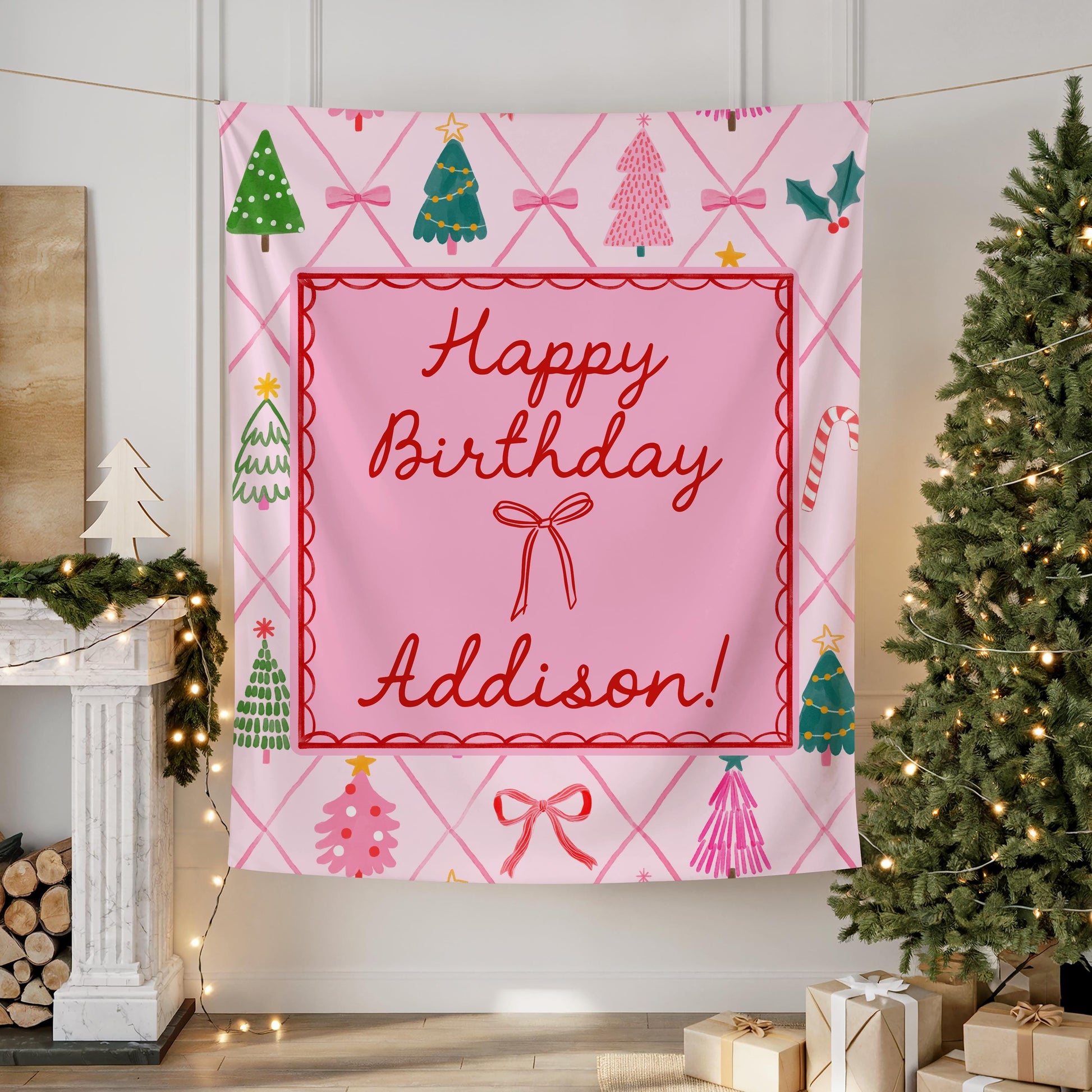 Pink Christmas birthday backdrop with festive trees, bows, and candy canes, personalized with “Happy Birthday Addison” in red script.