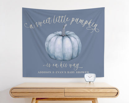 Dusty Blue baby shower fabric backdrop featuring slate blue pumpkin graphic and reads "a sweet little pumpkin is on his way"