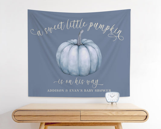 Dusty Blue baby shower fabric backdrop featuring slate blue pumpkin graphic and reads &quot;a sweet little pumpkin is on his way&quot;