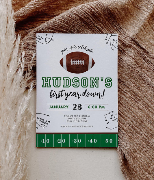 first year down football birthday invitation with watercolor football graphic and play outlines