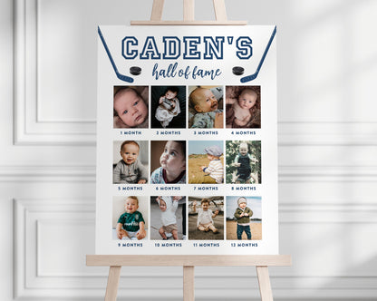 Hockey Hall of Fame Editable Photo Board for 1st birthday party featuring baby's 12 months photos. Hockey sticks and pucks surround child's name and "hall of fame".  Colors and fonts can be changed.