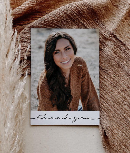 photo thank you card for graduation, wedding, shower. modern minimalist design with photo and black and white bottom with hand written font reading "thank you"