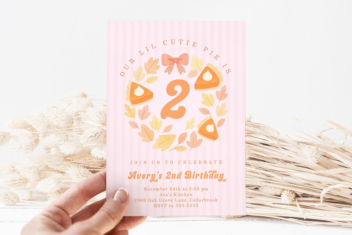 Second birthday invitation in cutie pie theme with pumpkin pie graphics, bow, leaves and stripes.
