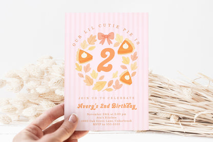Second birthday invitation in cutie pie theme with pumpkin pie graphics, bow, leaves and stripes.