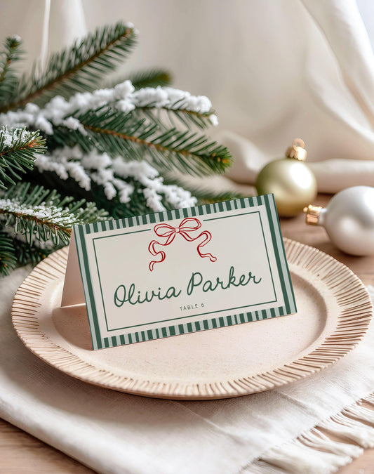 christmas place card with green striped background and elegant red coquette bow