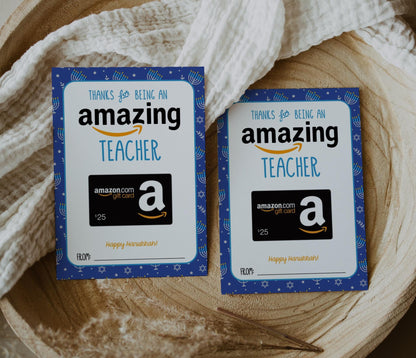 Hanukkah gift card holder for Amazing teacher holding amazon gift card. blue background with jewish star of david and menorahs in white and silver accents of yellowish gold.  Reads &quot;thanks for being an amazing teacher, happy hanukkah!&quot;  Spot at bottom to write who it&#39;s from.