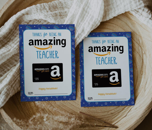 Hanukkah gift card holder for Amazing teacher holding amazon gift card. blue background with jewish star of david and menorahs in white and silver accents of yellowish gold.  Reads &quot;thanks for being an amazing teacher, happy hanukkah!&quot;  Spot at bottom to write who it&#39;s from.