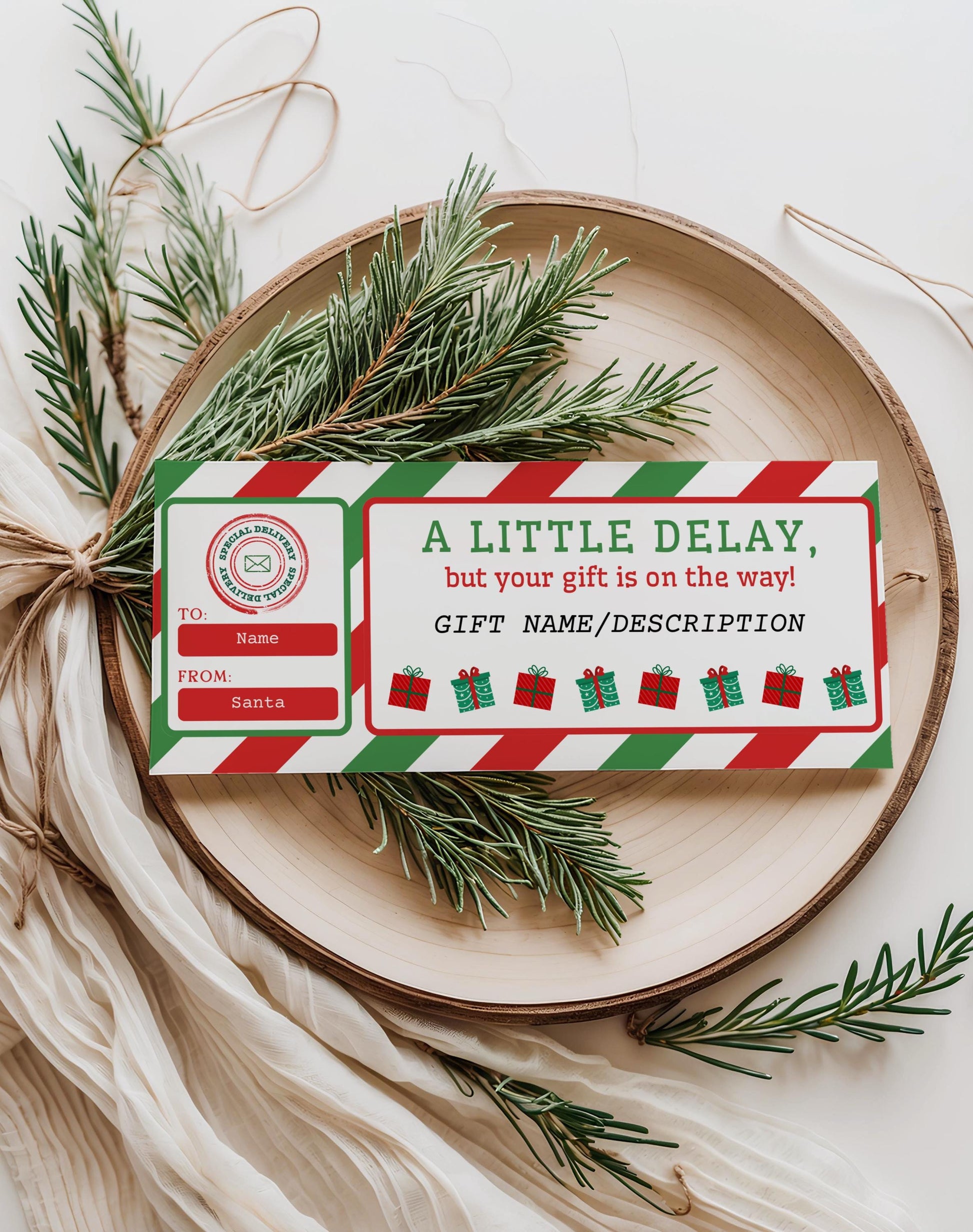 Editable Christmas gift delay certificate template in red and green stripes displayed on a holiday tray with pine branches; printable Canva late gift note
