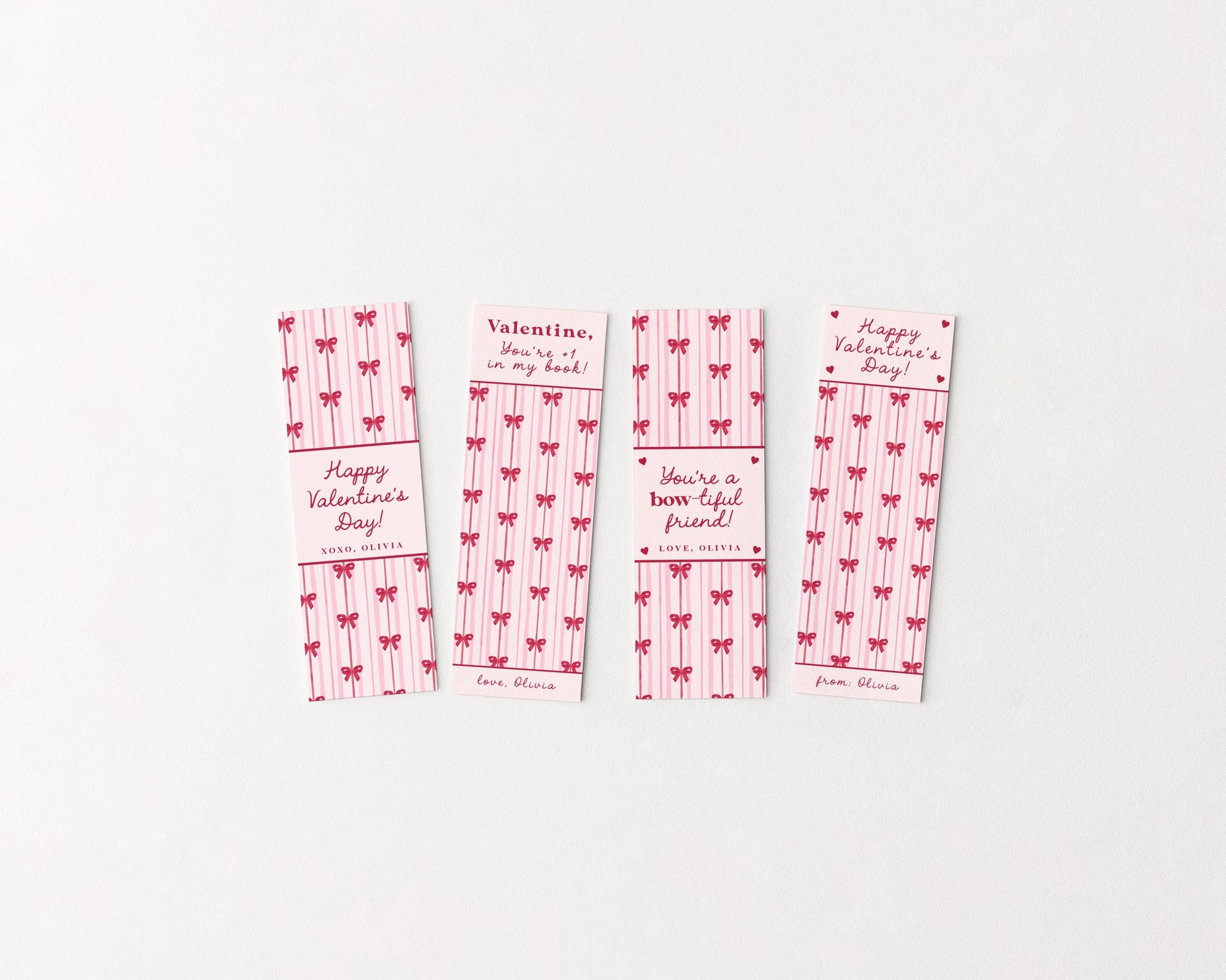 Pink bow Valentine bookmark printables with striped bow pattern and Valentine sayings, styled on a clean white background in a minimalist flat lay.
