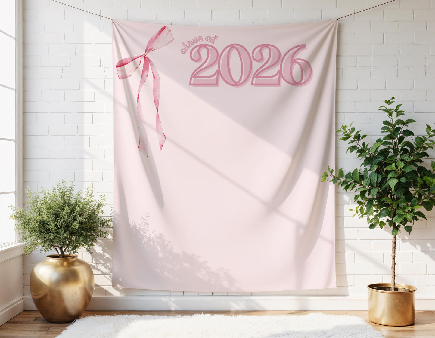 Pink Class of 2026 graduation backdrop with bow, blush preppy coquette party banner for photo booth decor