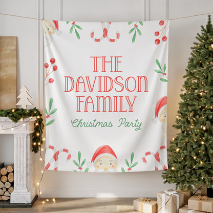 large fabric banner for photo backdrop at family christmas party or company work holiday event.  watercolor santa, candy canes, holly and berry graphics surround the wording "THE DAVIDSON FAMILY Christmas Party".