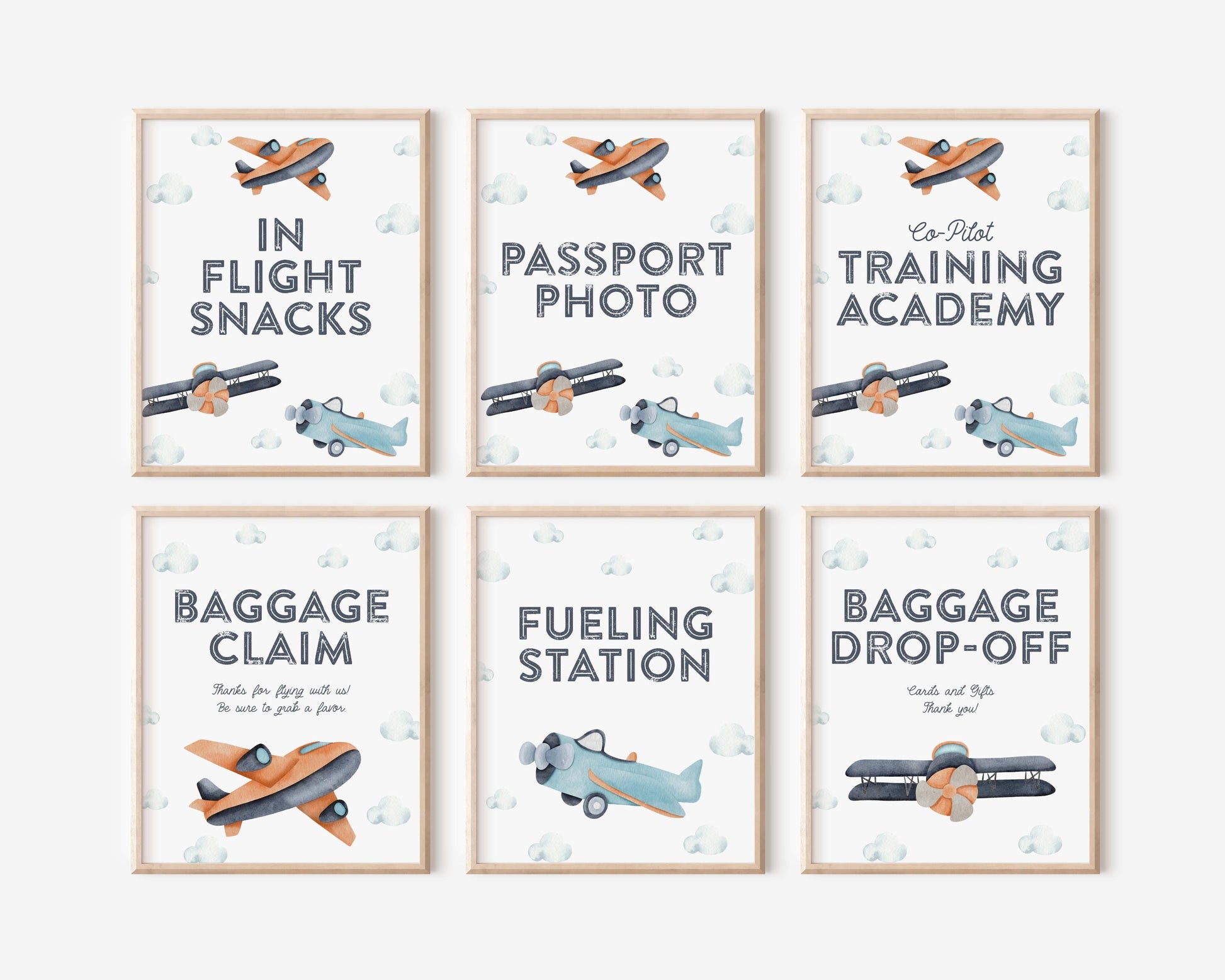 set of 6 framed party signs for airplane themed birthday.  modern minimal design of navy blue, turquoise and orange watercolor plane and cloud graphics.  In-flight Snacks, Passport Photo, Co-Pilot Training Academy, Baggage Claim, Fueling Station and Baggage Drop-off